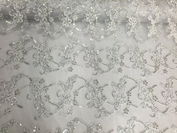 White/silver 3d flowers ribbon embroider with a metallic tread on a mesh lace fabric-wedding-prom-bridal-nightgown fabric-sold by the yard.
