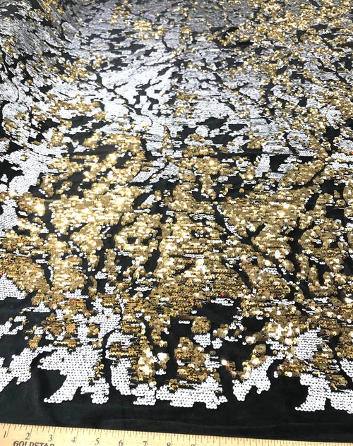 Camouflage flip sequin design on a black stretch velvet, Sold by the yard.