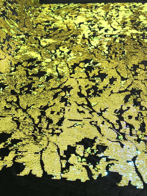 Camouflage flip sequin design on a black stretch velvet, Sold by the yard.