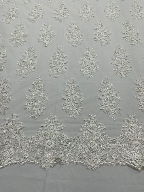 Floral embroider with sequins on a mesh lace fabric-sold by the yard.